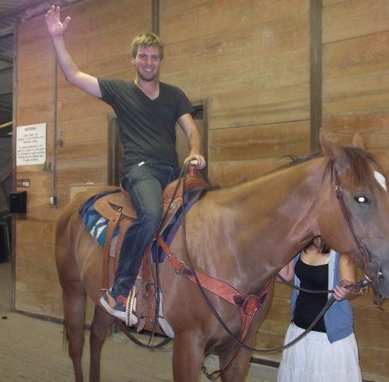 Tom Bourlet riding a horse